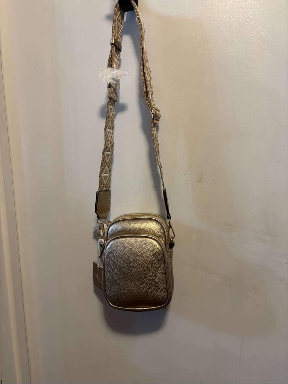 Compact Metallic Gold Crossbody Bag with Patterned Strap
